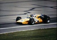 Denny Hulme  (magenta hue on photo edges)