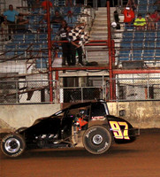 Tyler "Sunshine" Courtney takes the last checker at the Fairgounds Mile.