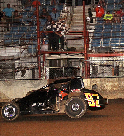 Tyler "Sunshine" Courtney takes the last checker at the Fairgounds Mile.
