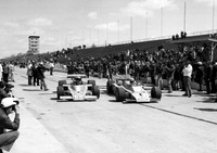 Hiss hits official Walt Meyers first day of practice Indy 1974.  Bigelow #27